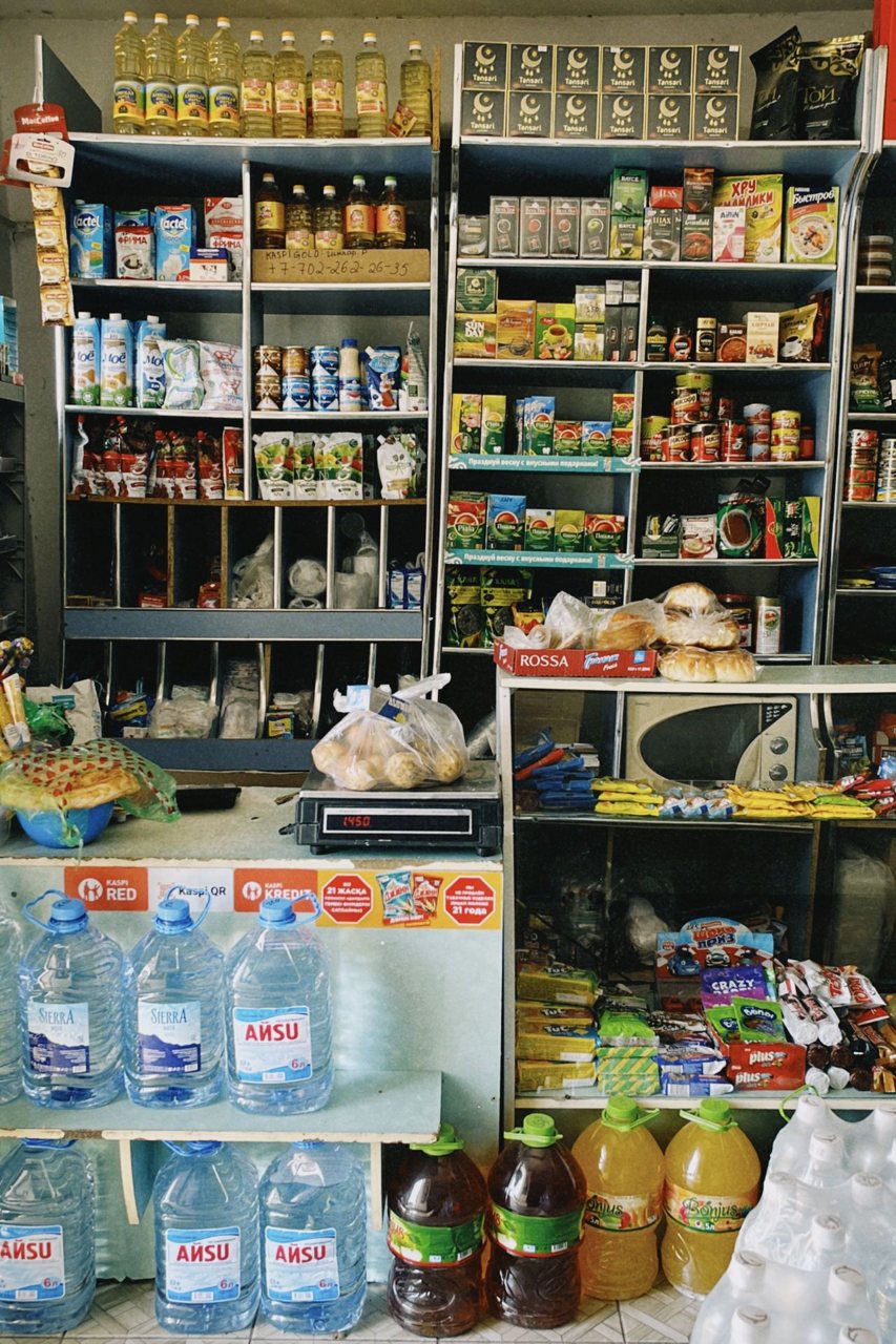 Free A diverse selection of products on display in a Shymkent grocery store, showcasing local and imported items. Stock Photo